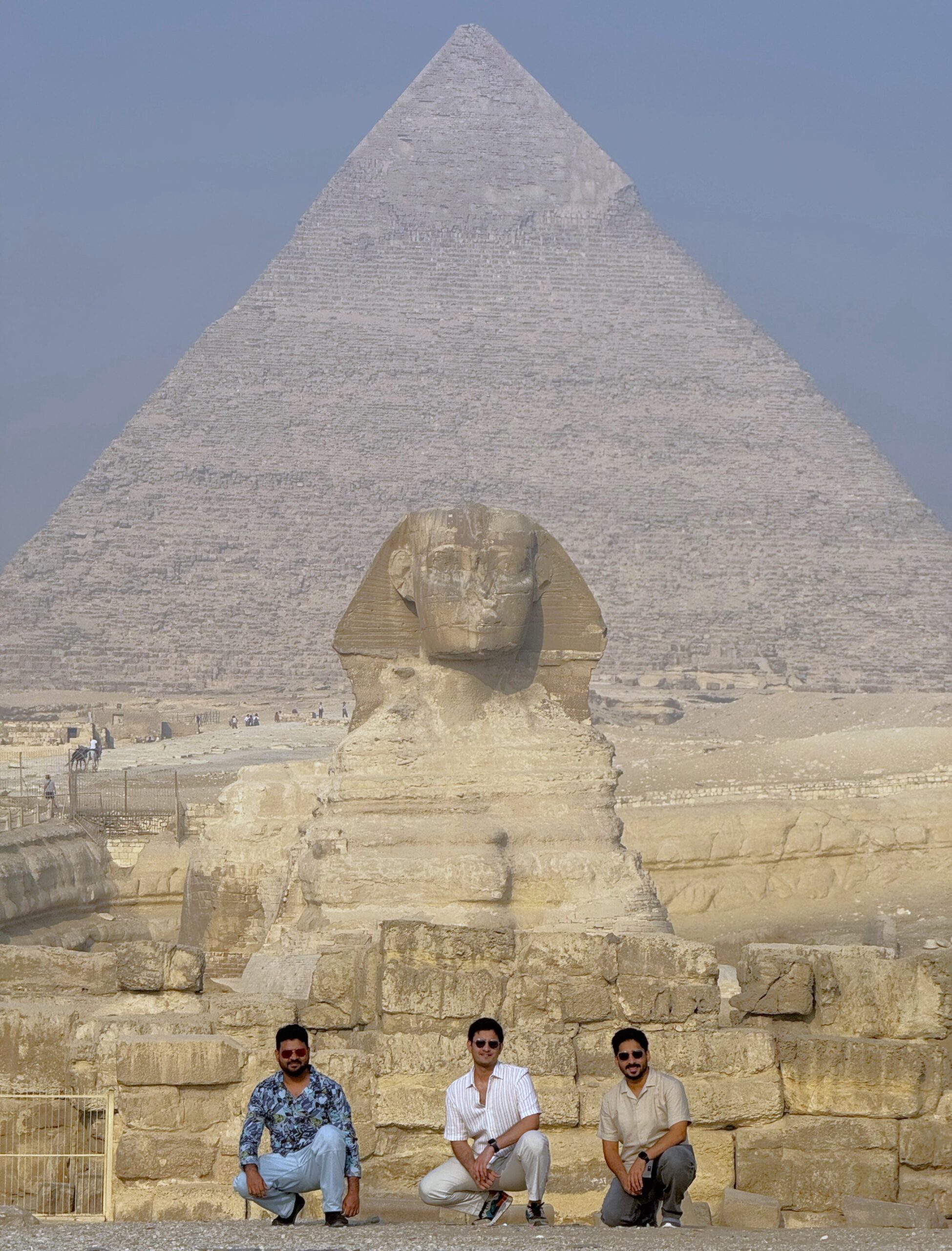 Tour group exploring ancient Egyptian Giza pyramids