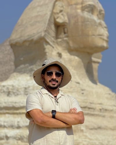 person in front of sphinx